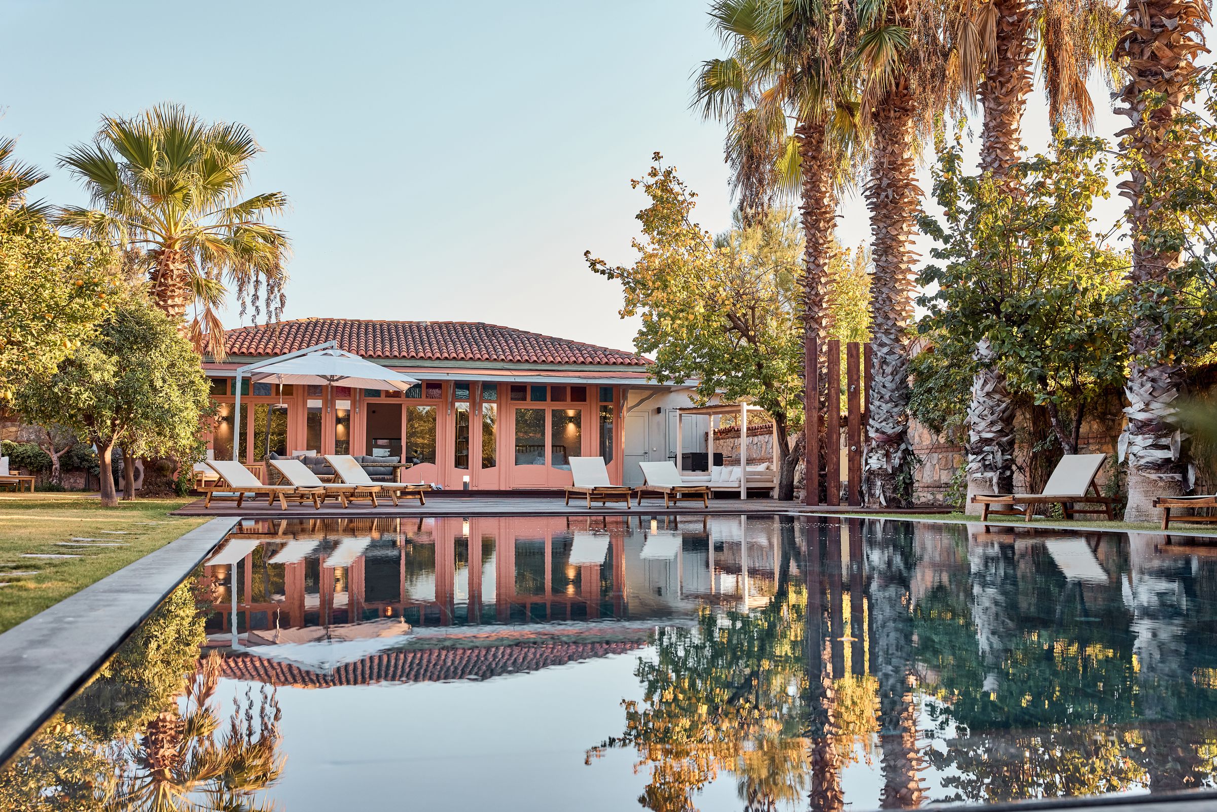 The pool and the estate at dusk
